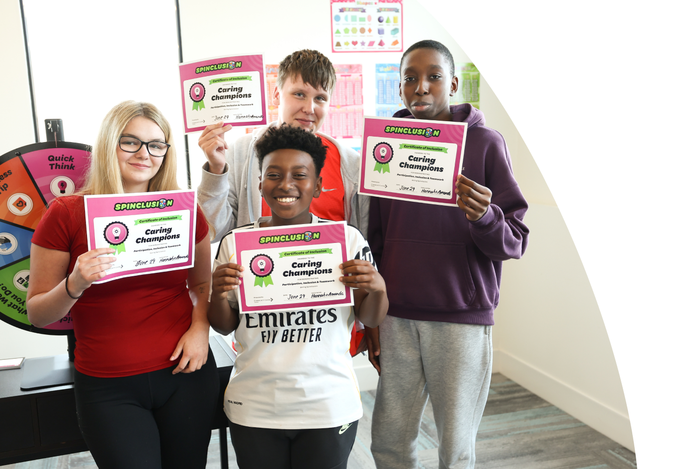 Students holding Caring Champions certificates